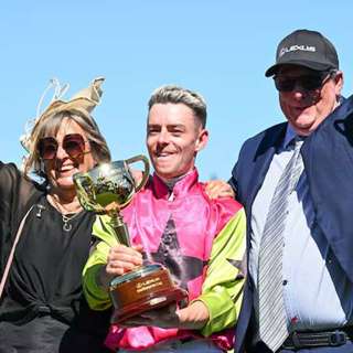Melbourne Cup winning trainer John Symonds with Mark and Caroline