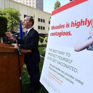 Why is measles spreading in America?