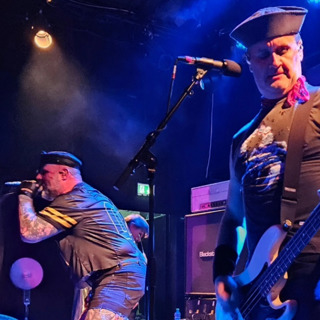 Episode 133: Small Feces: Turbonegro going SOLO - down in... Wels, Austria! What a treat!