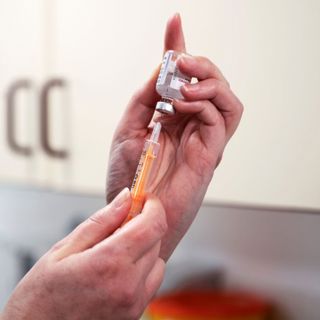 How many vaccinations are needed to end lockdown?
