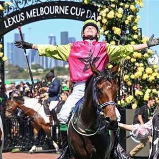 Melbourne Cup winning jockey Robbie Dolan with Mark and Caroline