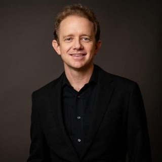 Thomas Heuser prepares to conduct his last concert with the Idaho Falls Symphony