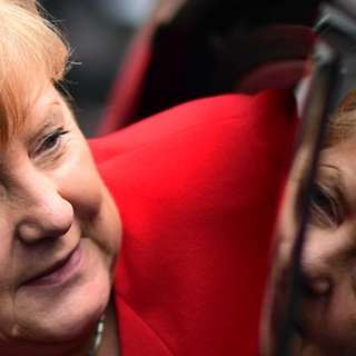 Georgescu Leads Romania Election, Merkel's Memoir Unveils Insights, Serbian Parliament Erupts Over Collapse, Hidalgo Backs Féraud for Mayor, and more...