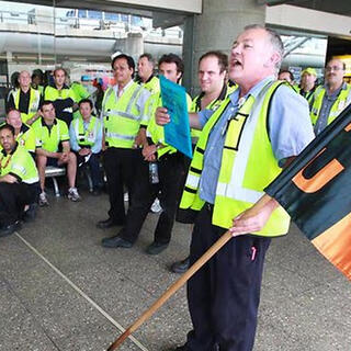 Hundreds of Qantas ground staff walk off the job