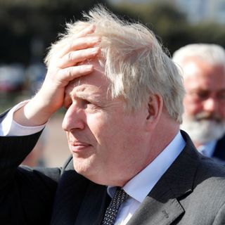 Why does Boris give out his phone number?