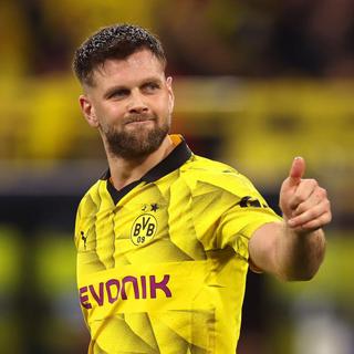 Fabulous Fullkrug finish secures Dortmund slender lead