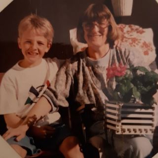 Mother and son playing hand games